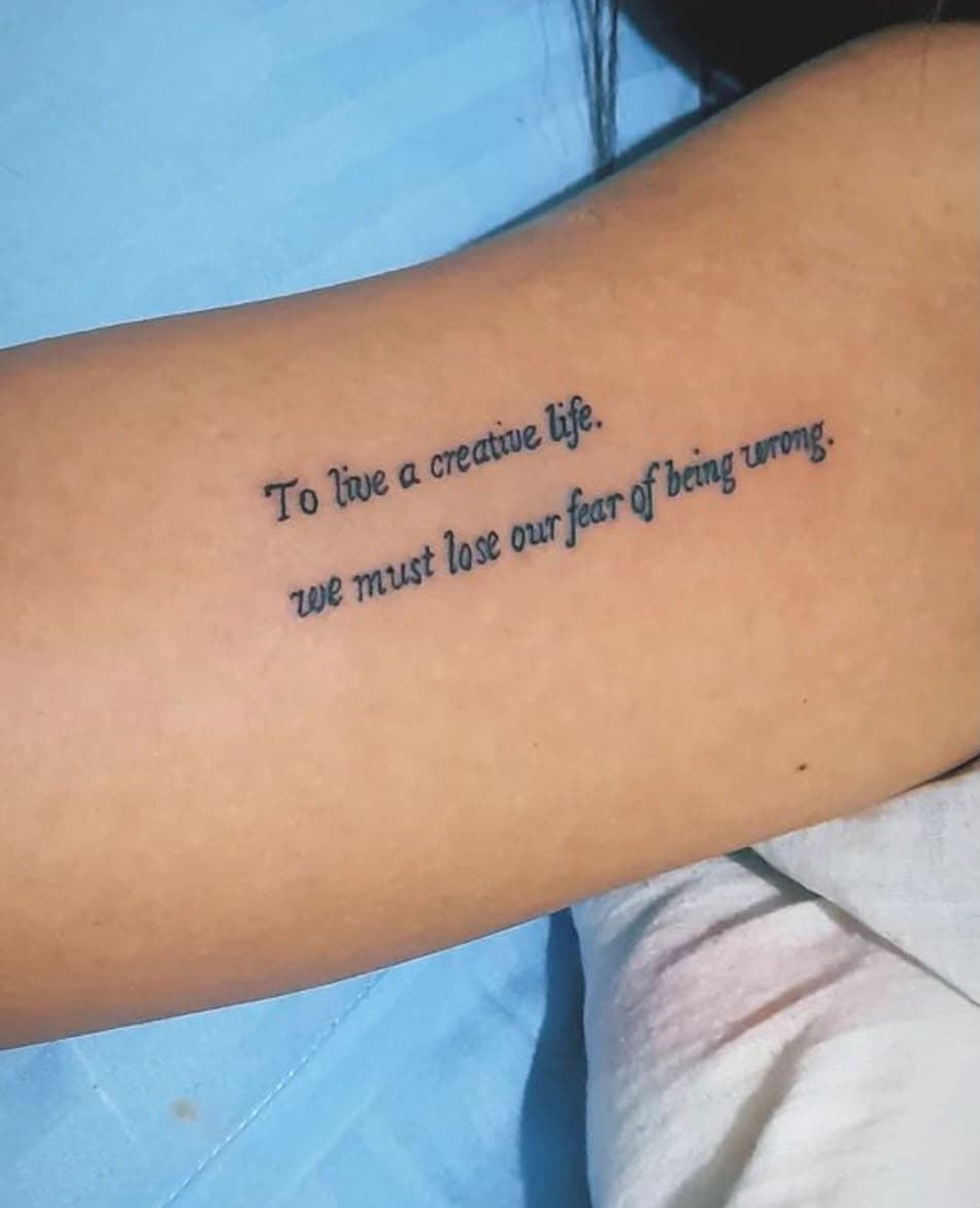 Script quote, inner arm — Fine Line